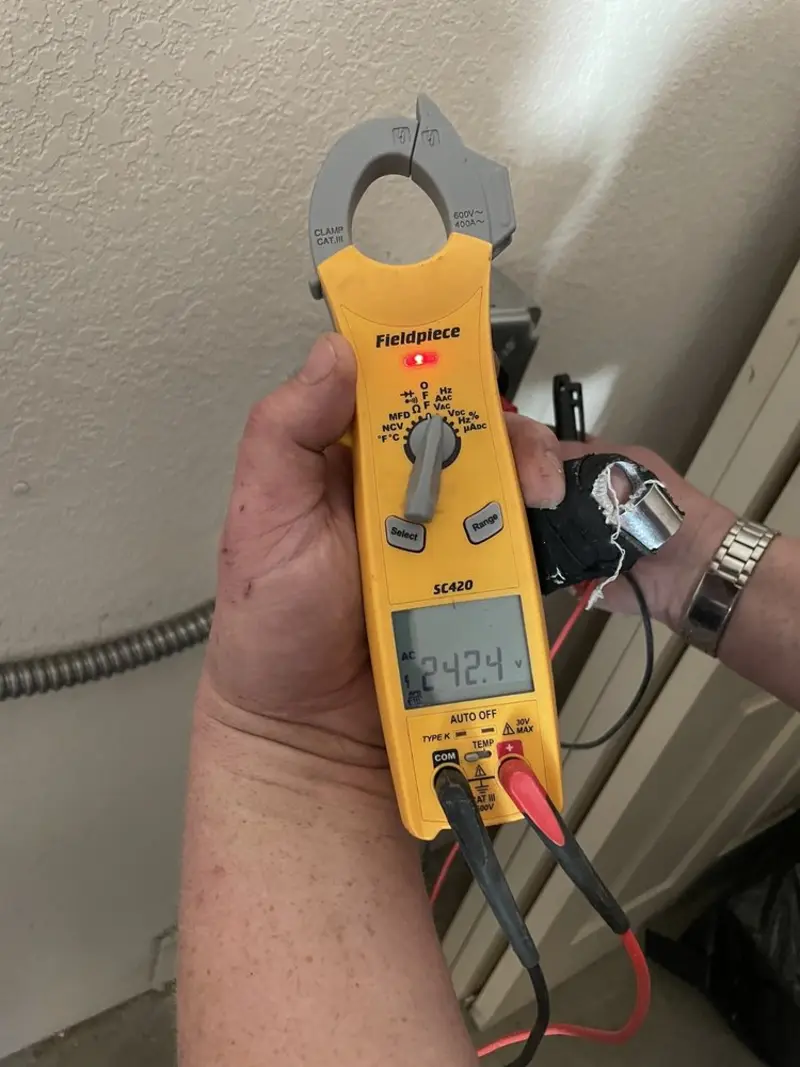 Voltage testing with clamp meter during Recessed Lighting Installation in Nampa